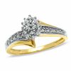 1/10 CT. T.W. Diamond Oval Cluster Ring in 10K Gold - Size 7