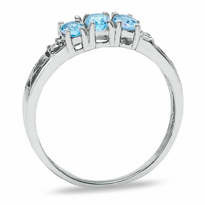 Oval Blue Topaz Three Stone Ring in 10K White Gold - Size 7