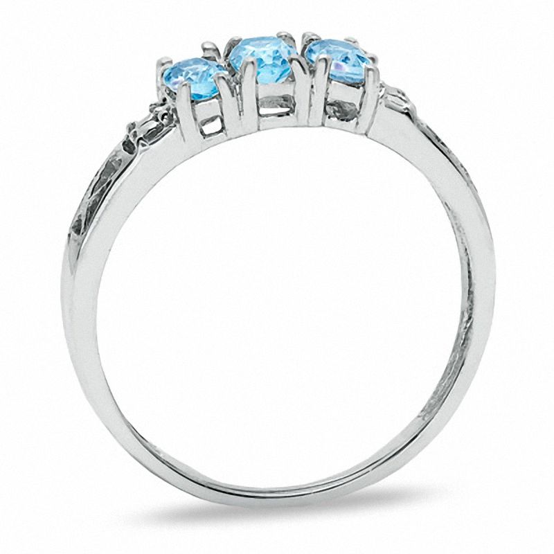 Oval Blue Topaz Three Stone Ring in 10K White Gold - Size 7