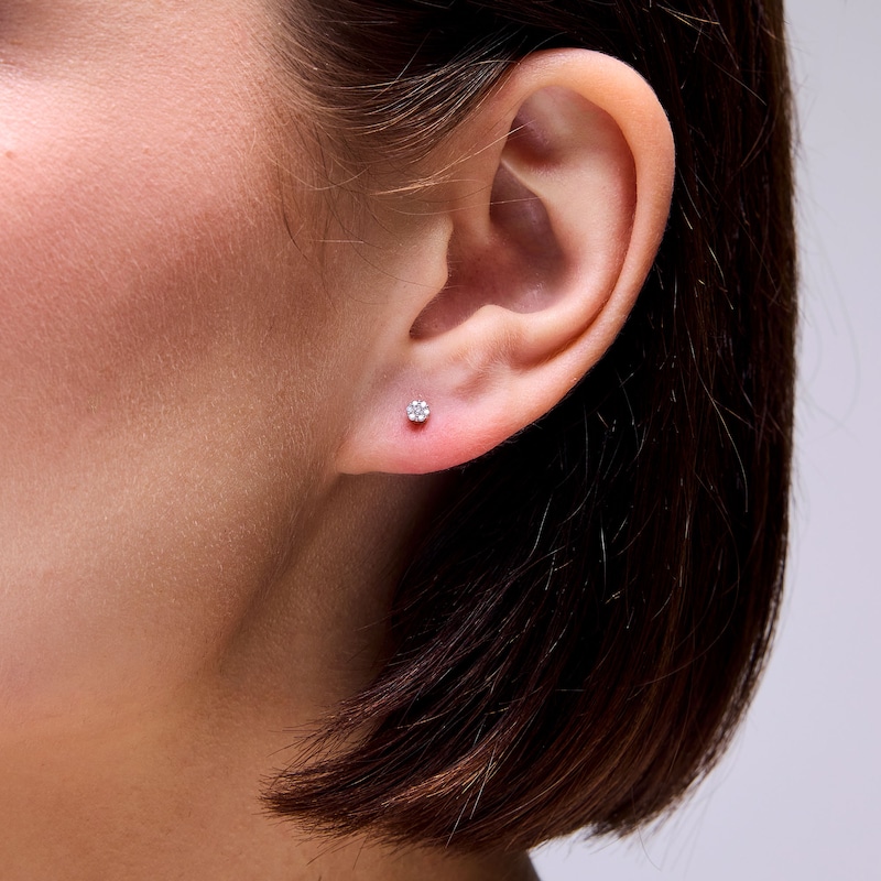 Main Image 2 of 1/20 CT. T.W. Diamond Seven Stone Illusion Earrings in 10K Gold