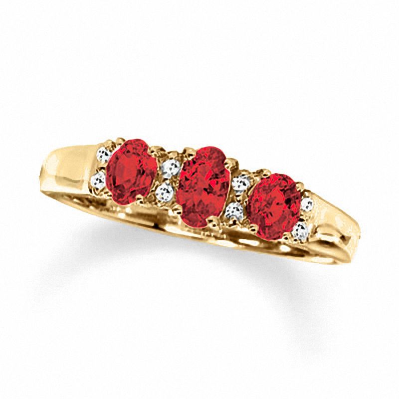 Oval Garnet Three Stone Ring in 10K Gold with Diamond Accents - Size 7
