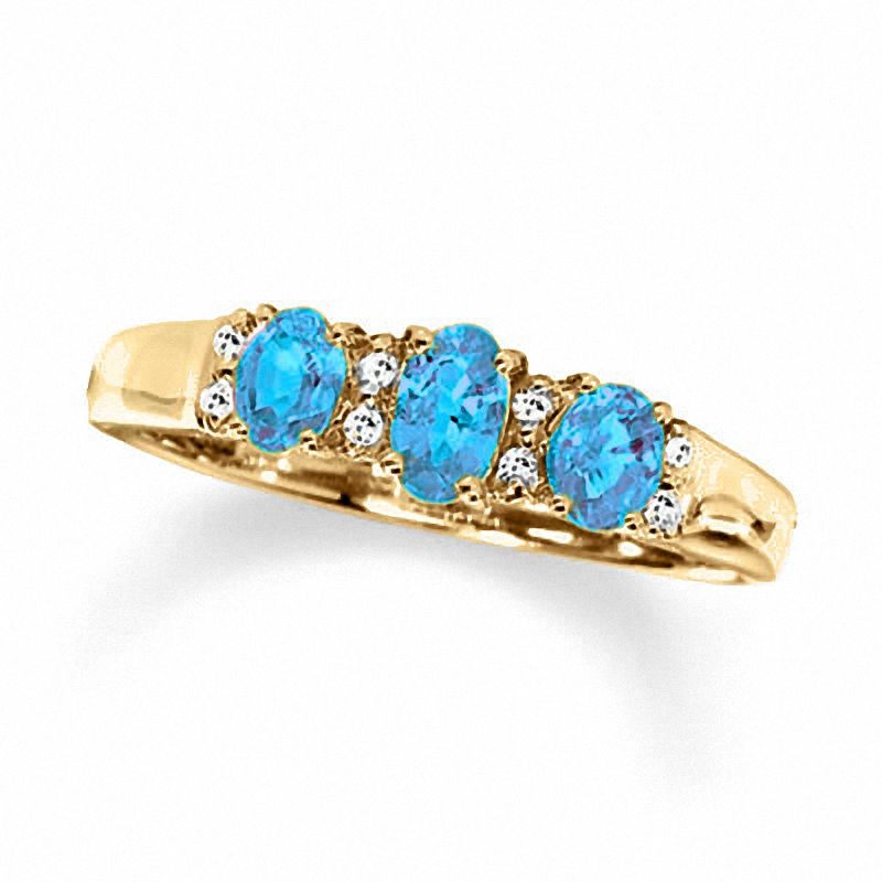 Oval Blue Topaz Three Stone Ring in 10K Gold with Diamond Accents - Size 7