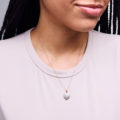10K Gold 1/5 CT. T.W. Diamond Heart-Shaped Frame Pendant - 18"