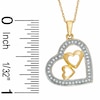 1/10 CT. T.W. Diamond Heart Pendant in 10K Gold - 16"
