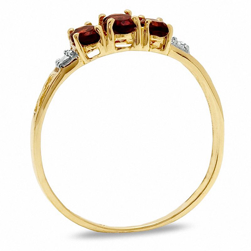 Oval Garnet Three Stone Ring in 10K Gold - Size 7