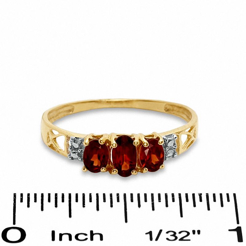 Oval Garnet Three Stone Ring in 10K Gold - Size 7
