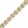 1/10 CT. T.W. Diamond Cluster X Bracelet in 18K Gold-Plated Sterling Silver - 7.25"
