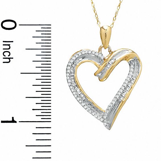 1/4 CT. T.W. Round and Baguette Diamond Heart Pendant in 10K Gold
