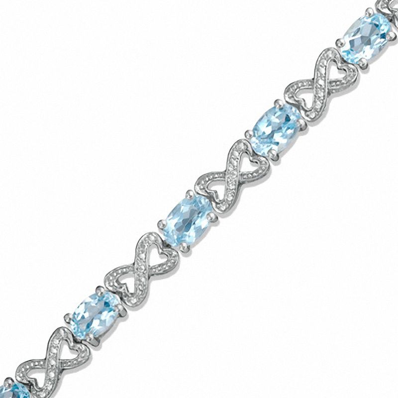 Main Image 1 of Oval Blue Topaz and Diamond Bracelet in Sterling Silver - 7.25"