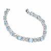 Thumbnail Image 2 of Oval Blue Topaz and Diamond Bracelet in Sterling Silver - 7.25"