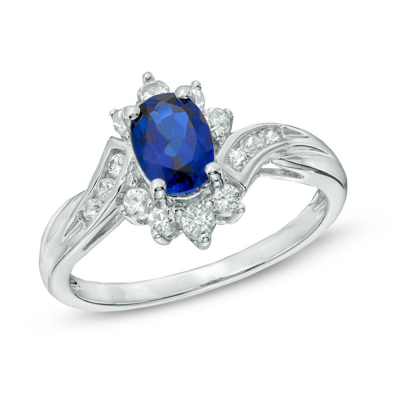 Oval Lab-Created Blue and White Sapphire Starburst Frame Bypass Ring in Sterling Silver