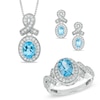 Thumbnail Image 0 of Oval Blue Topaz and Cubic Zirconia Frame Pendant, Ring and Earrings Set in White Rhodium Brass