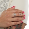 1/10 CT. T.W. Composite Diamond and Pink Sapphire Accent Swirl Frame Promise Ring in Sterling Silver