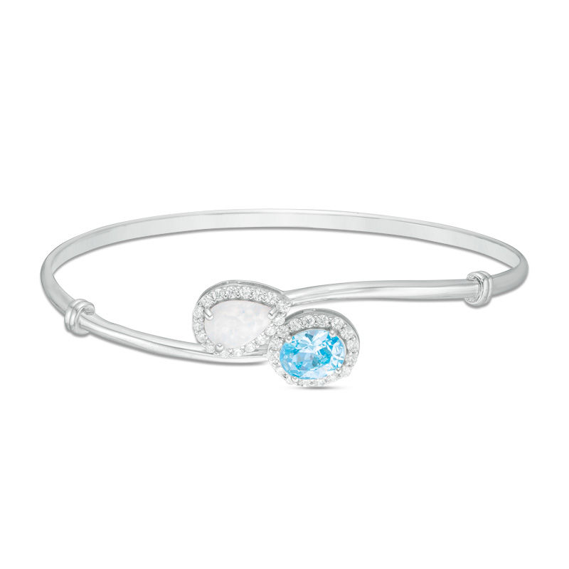 Main Image 1 of Pear-Shaped Lab-Created Opal and Oval Blue Cubic Zirconia Bypass Bangle in Sterling Silver