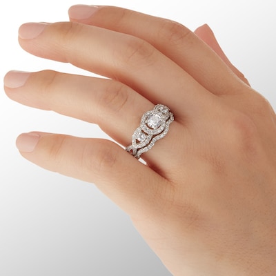 Cubic Zirconia Three Stone Frame Twist Shank Bridal Set in Sterling Silver