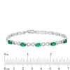 Thumbnail Image 2 of Oval Simulated Emerald and Diamond Accent Infinity Link Bracelet in Sterling Silver - 7.25"