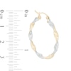 Thumbnail Image 2 of 30mm Diamond-Cut Twist Hoop Earrings in 14K Tube Hollow Two-Tone Gold