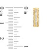 1/3 CT. T.W. Baguette and Round Diamond Edge Huggie Hoop Earrings in 10K Gold