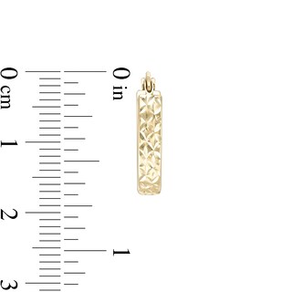 12.5 x 18mm Diamond-Cut "X" Oval Flat Hoop Earrings in 10K Tube Hollow Gold