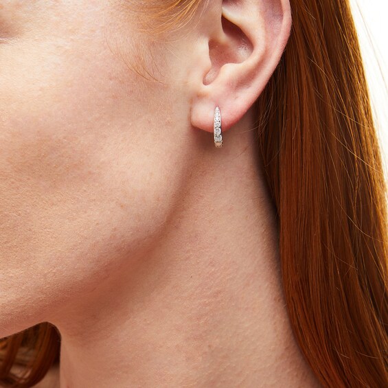 ​​​​​​​Sterling Silver CZ Graduated Stone Huggies