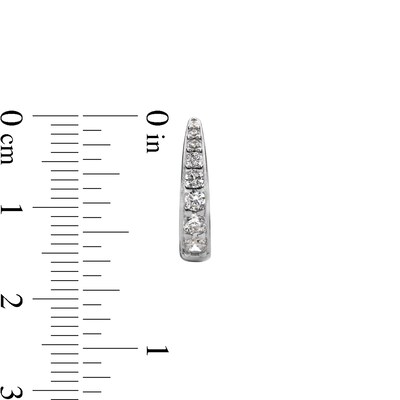 ​​​​​​​Sterling Silver CZ Graduated Stone Huggies