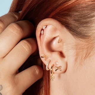 10K Gold Bow Huggie Hoops
